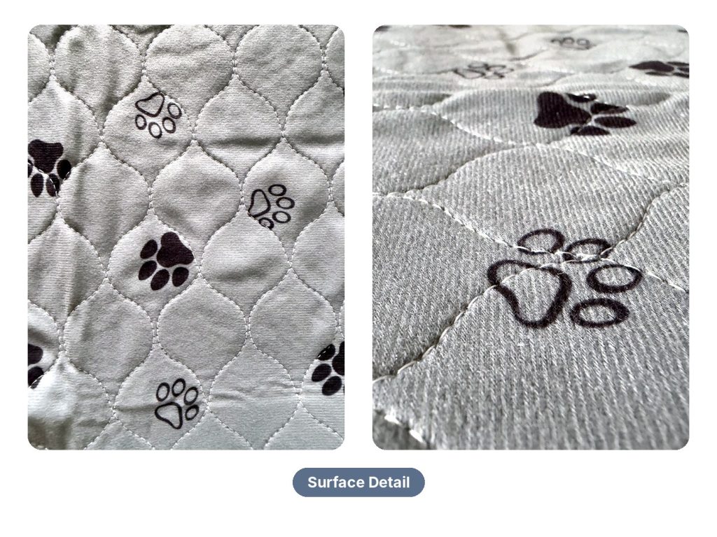 Surface detail of the quilted paw-print top